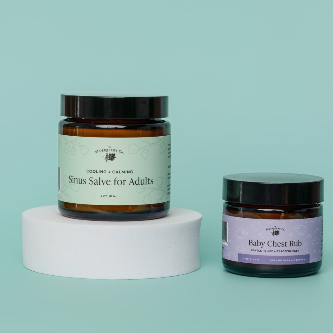 Two jars of natural remedies on a light blue background