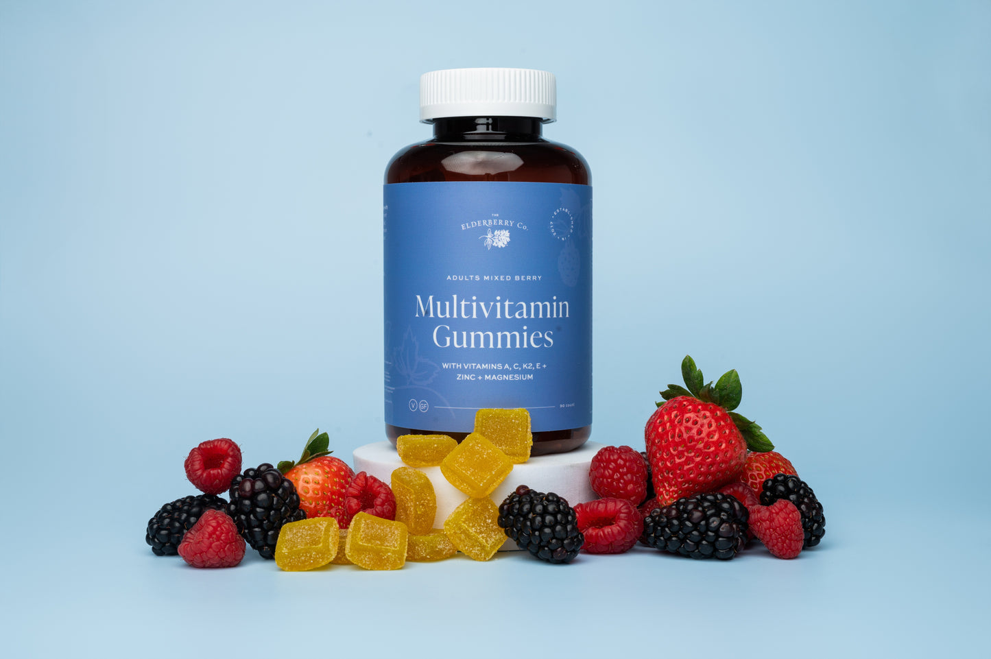 Multivitamin gummies with a bottle labeled 'Multivitamin Gummies' on a light blue background.