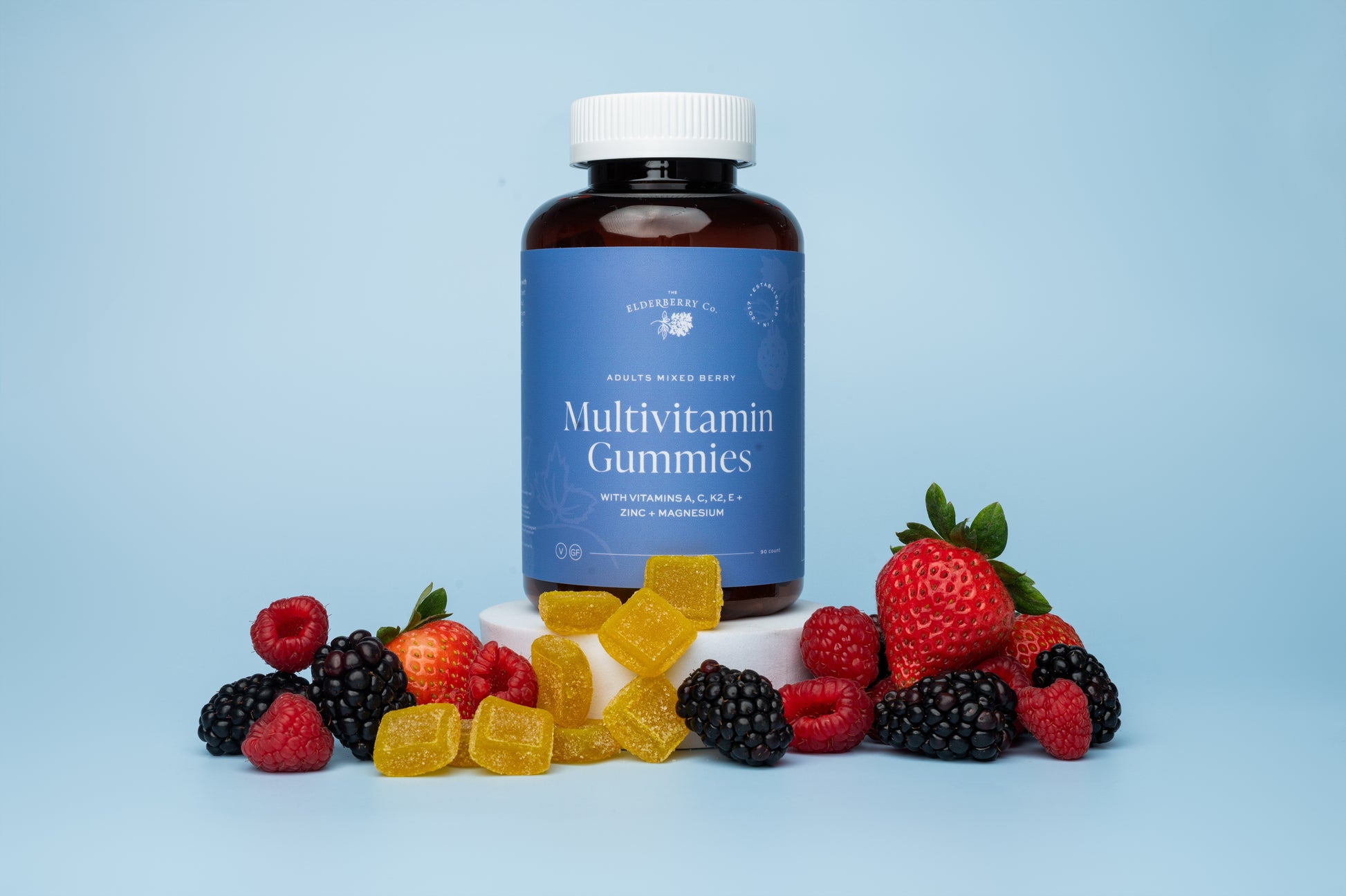 Multivitamin gummies with a bottle labeled 'Multivitamin Gummies' on a light blue background.