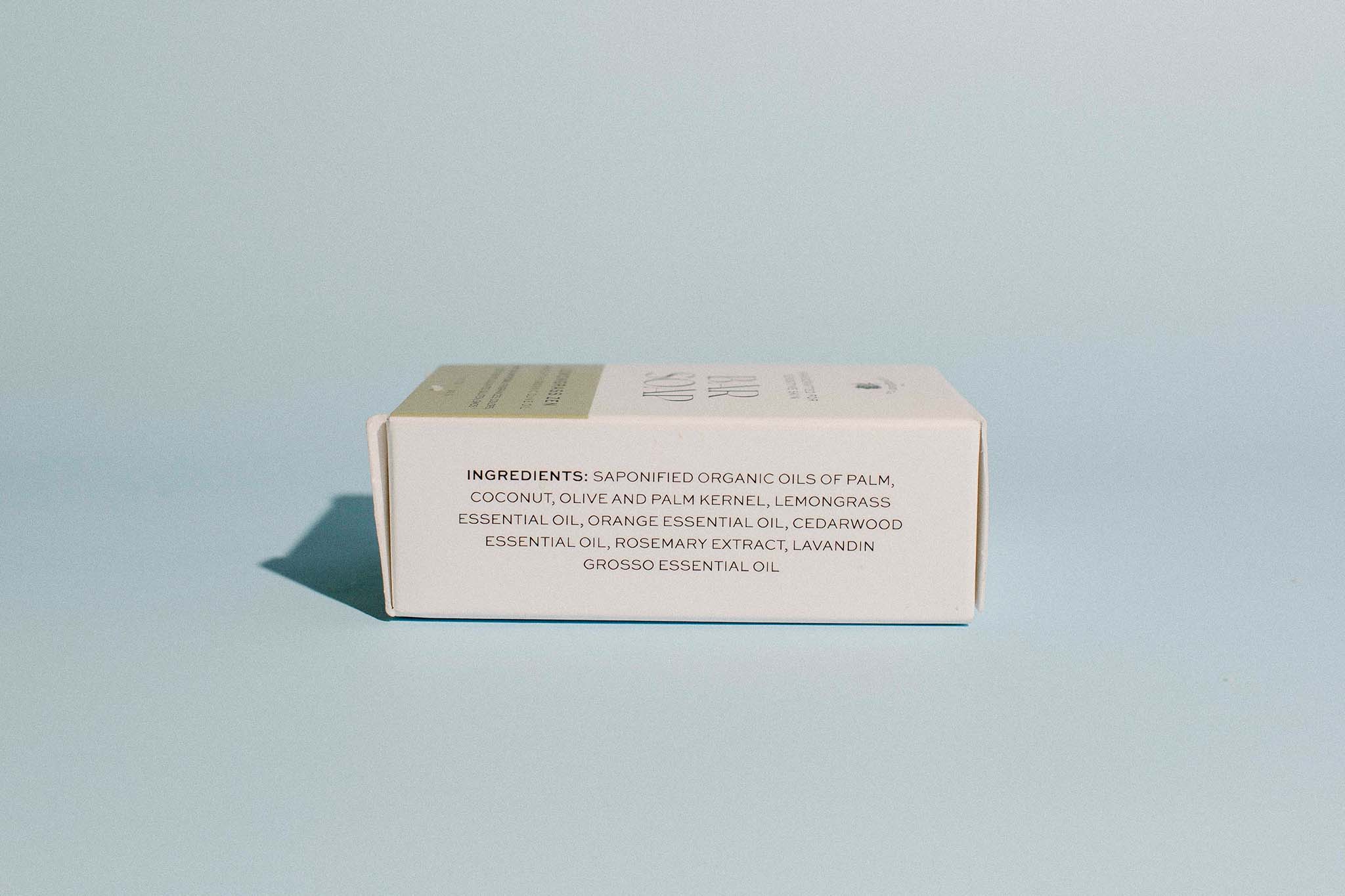 Bottom view of The Elderberry Co. Lemongrass Zen bar soap box displaying the full ingredient list and organic essential oil blend.