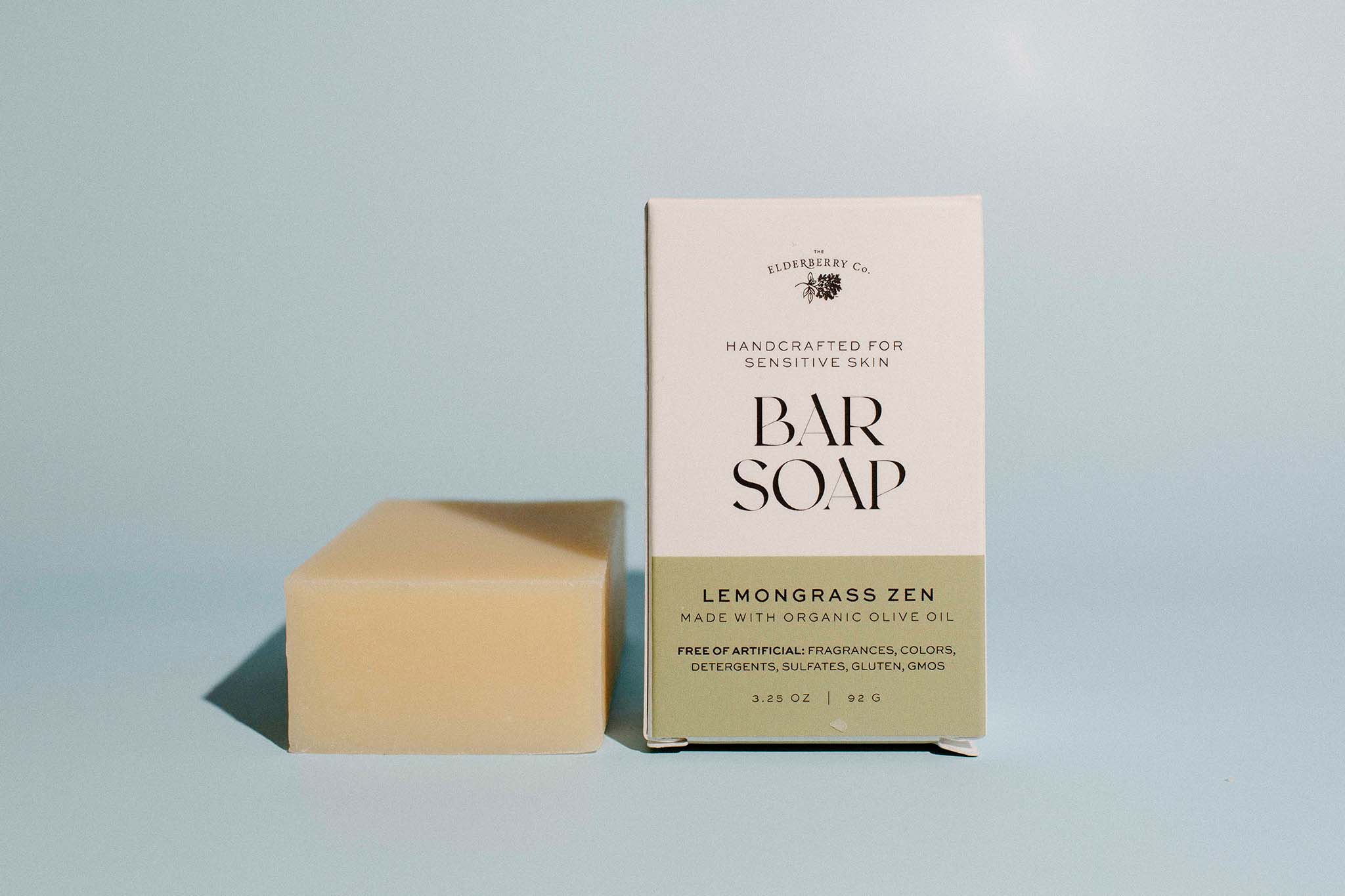 Bar of soap and its packaging with 'Lemongrass Zen' label on a light gray background