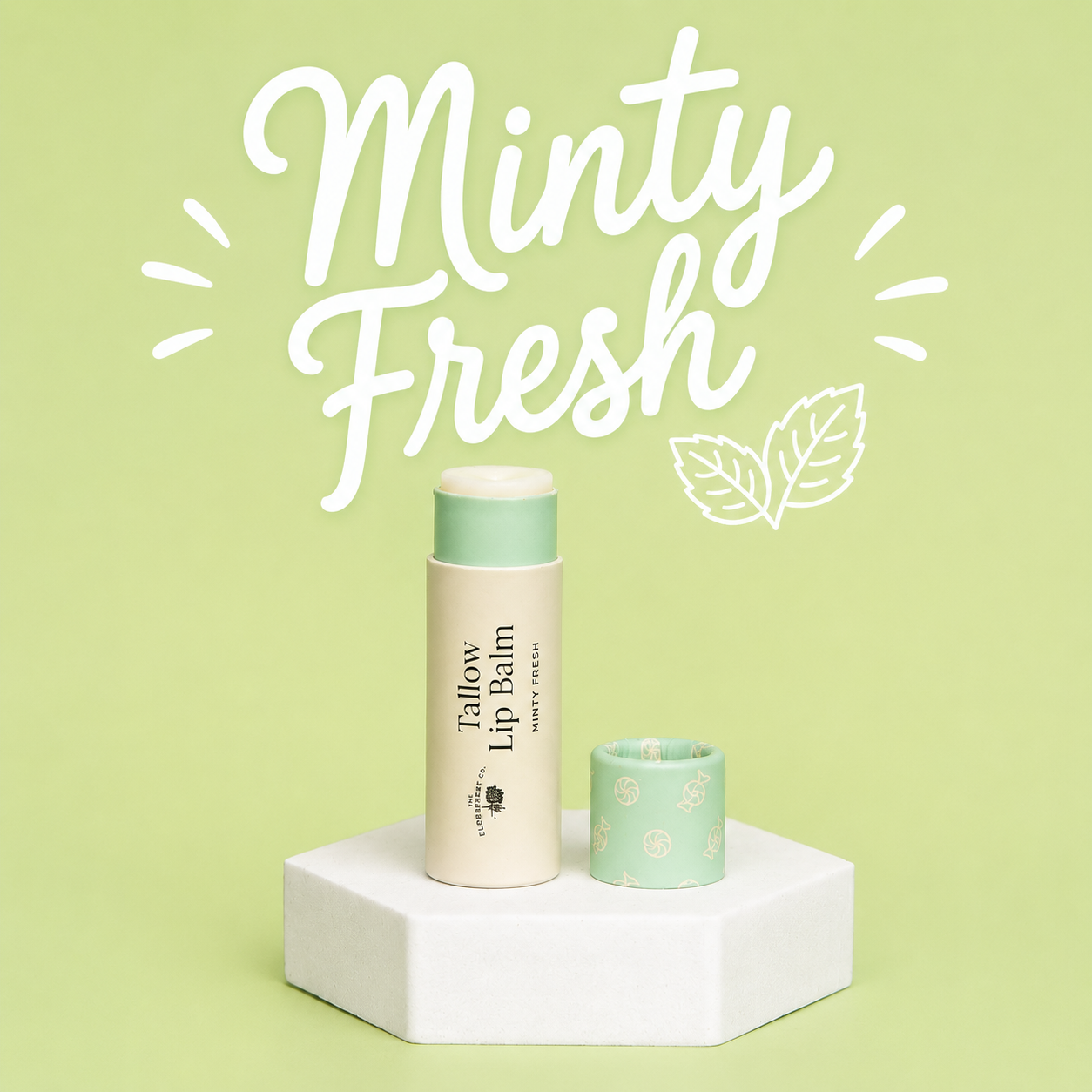 A minty fresh willow lip balm stick and its cap displayed on a white hexagonal pedestal against a light green background with white 'Minty Fresh' text and leaf graphics.