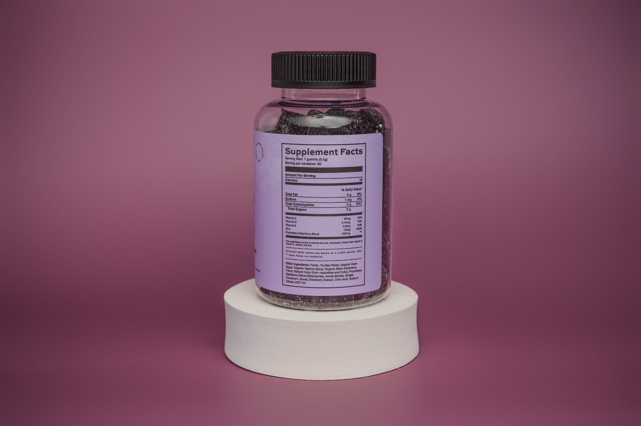 Product Supplement Label with purple background on white stand.