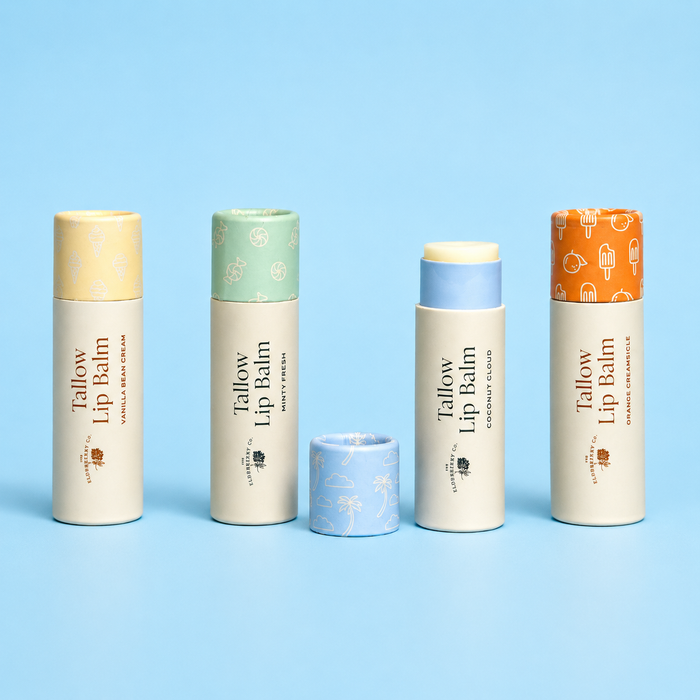 Set of Tallow Lip Balm containers with various colored lids on a blue background
