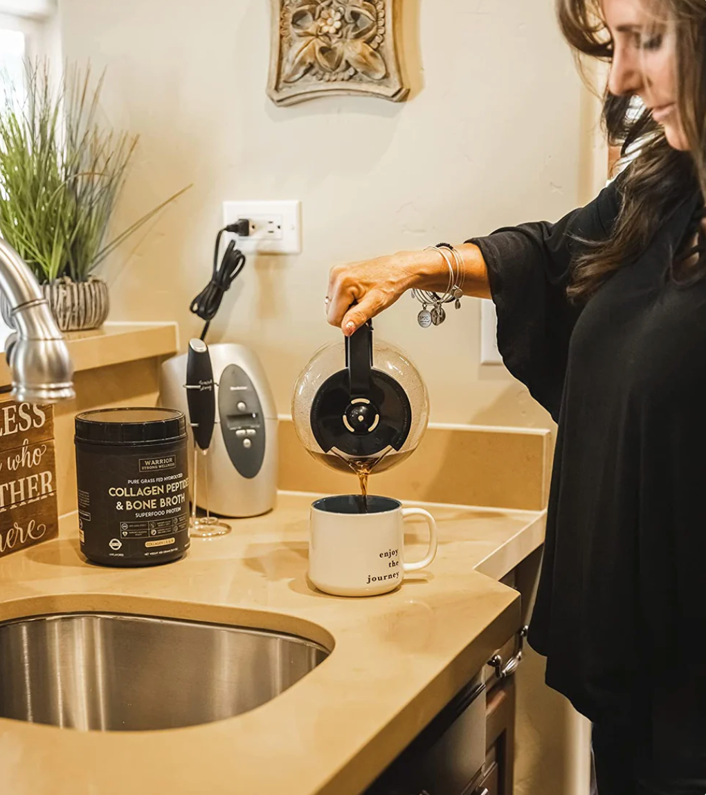 Woman preparing coffee with Warrior Strong Wellness Collagen Peptides & Bone Broth, showcasing an easy way to add collagen protein to a daily morning routine.