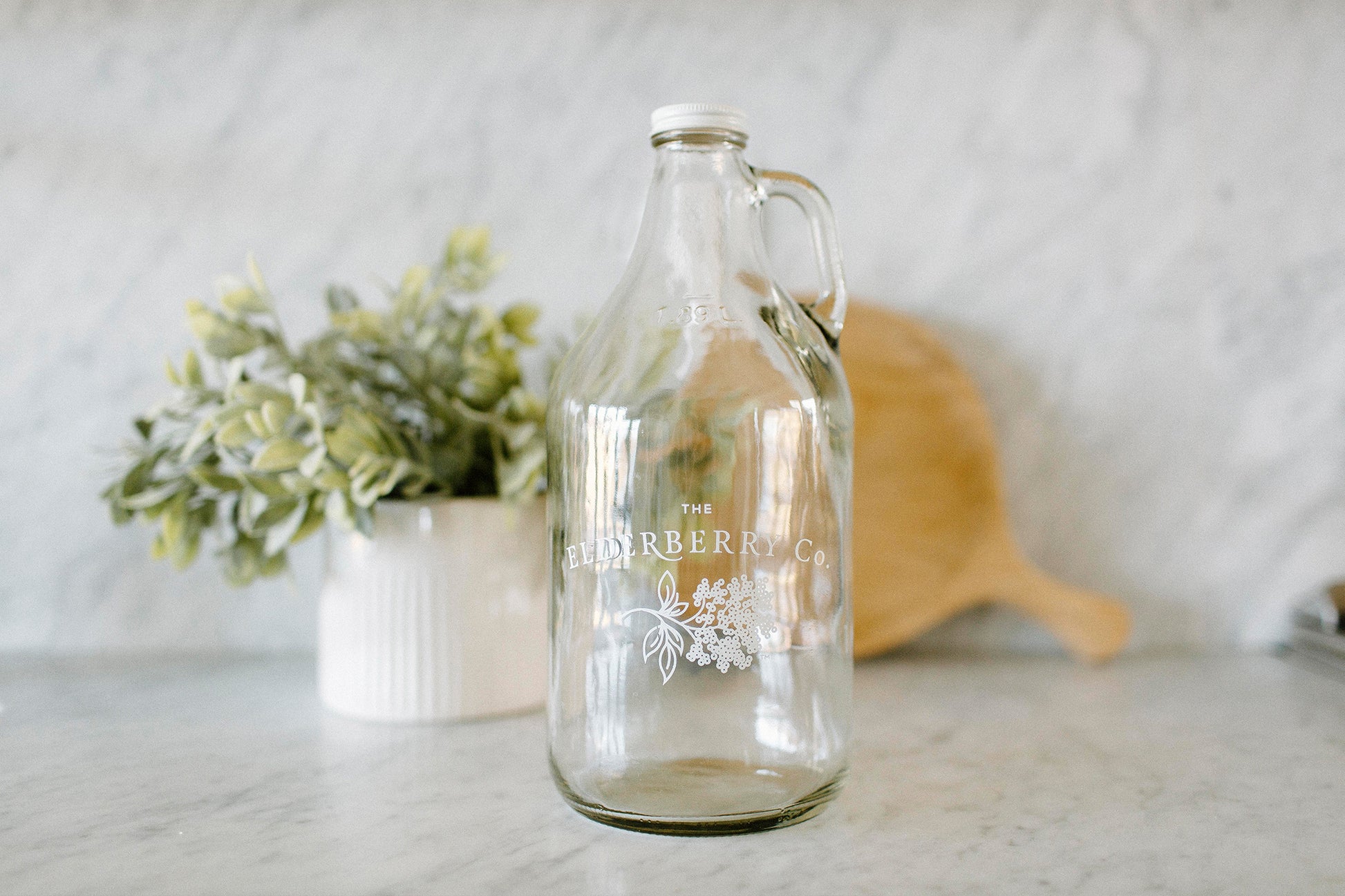 The Elderberry Co. Glass Growler